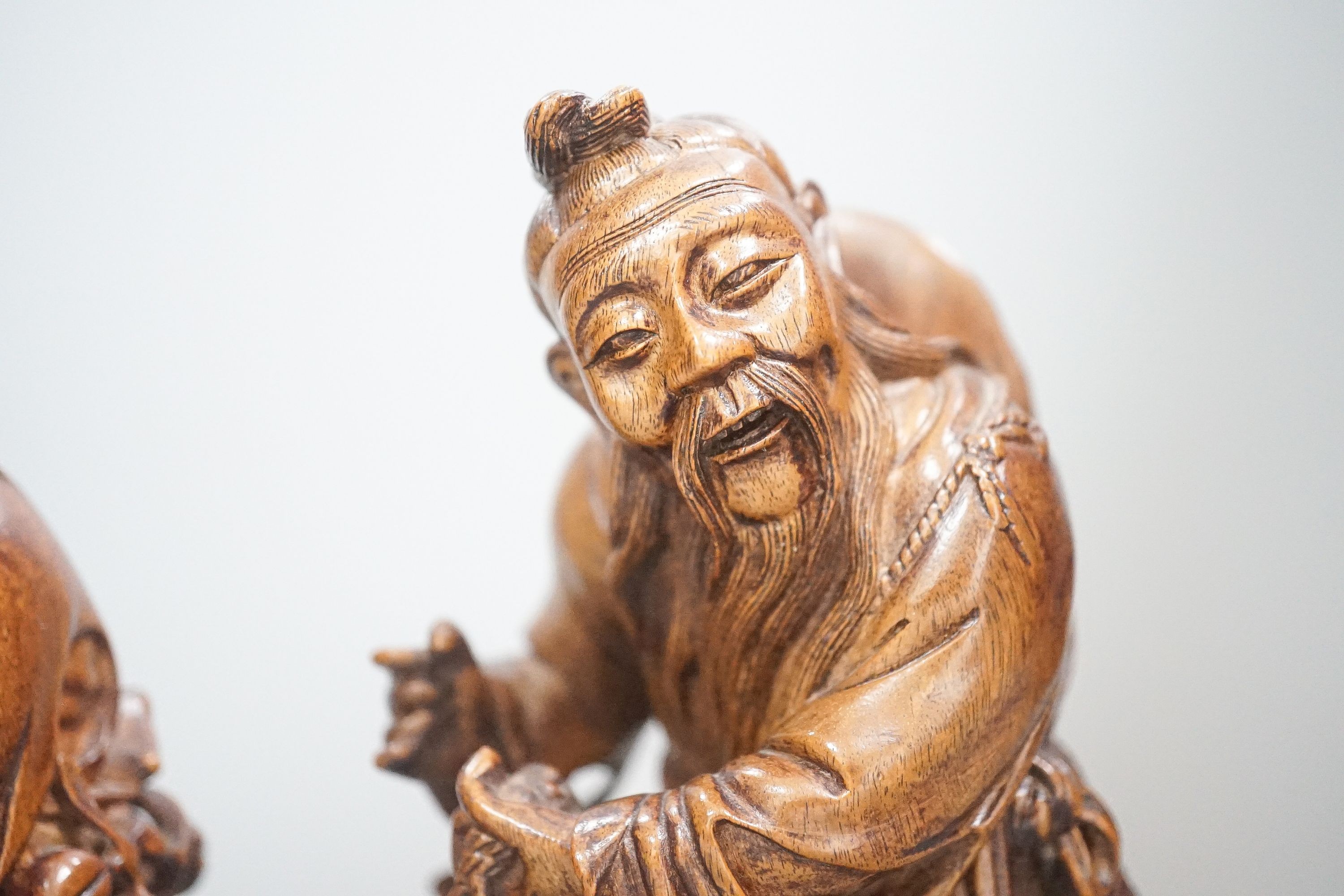 Two Chinese hardwood figures of a fisherman and a old man holding peaches 16cm